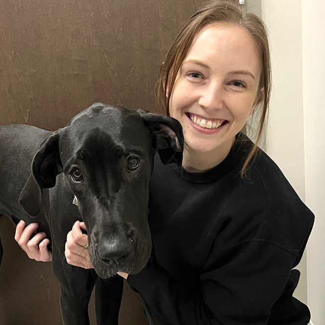 Olivia With Black Lab